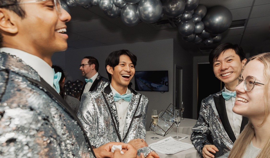 The team wore bright silver formal wear for their night of laughs and camaraderie